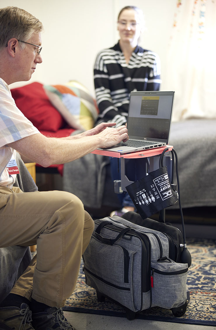 Man sitting and using a portable workstation